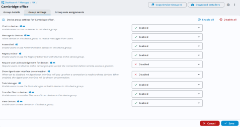 Device group settings page for the Cambridge office. A list of features such as chat, PowerShell, Registry Editor and Task Manager are shown, with drop-downs set to either Enabled or Disabled. All features are enabled except Require user acknowledgement for devices, which is disabled. Enable all and Disable all icons are in the top right and Cancel and Save buttons appear at the bottom.